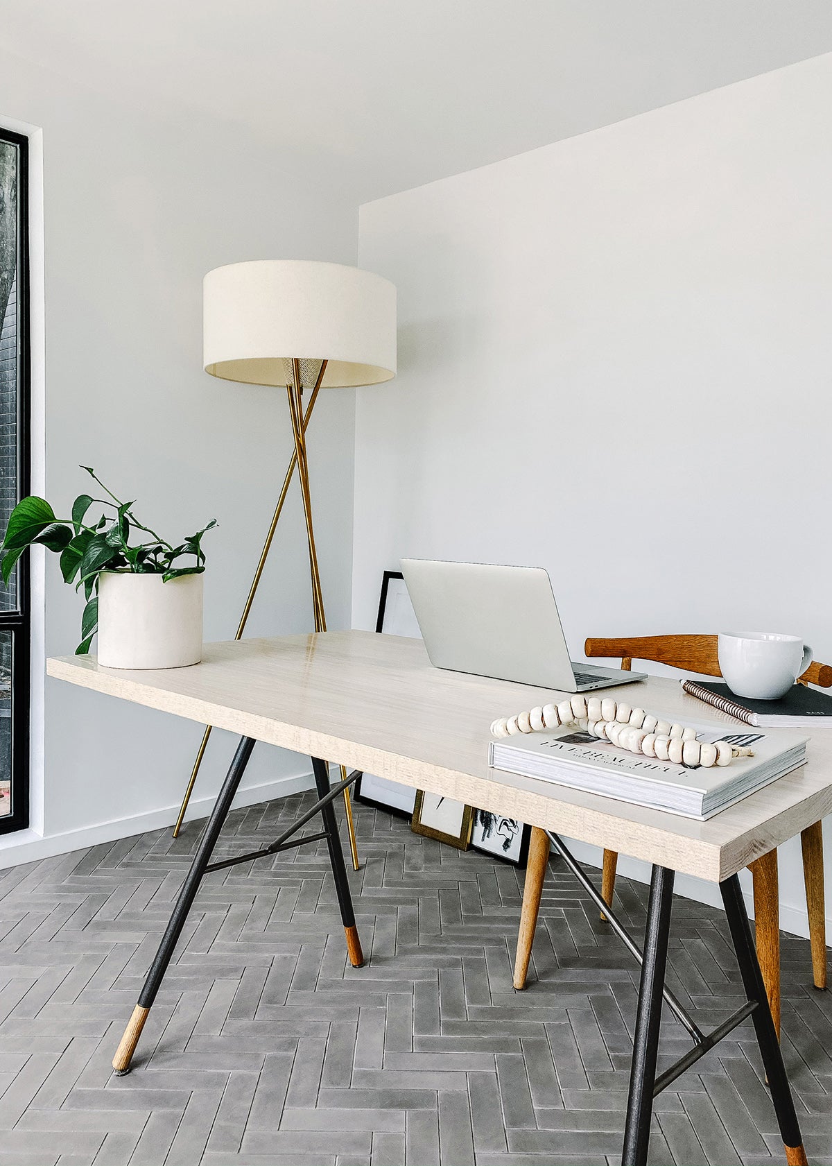 Home office with grey cement tile floor.