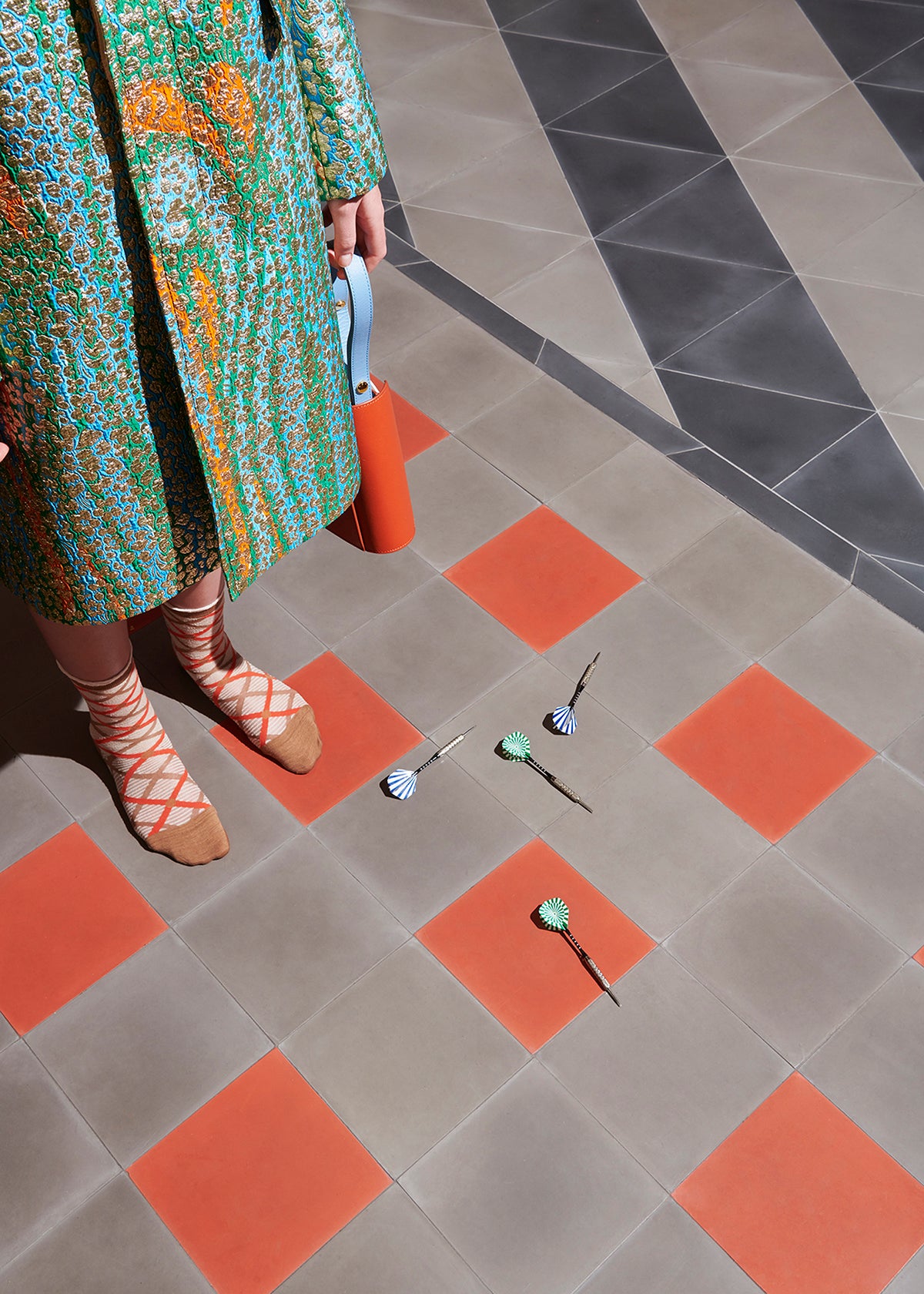 Grey and orange cement square floor.