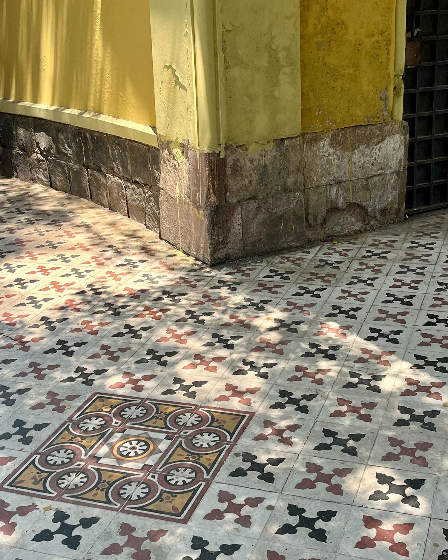 Navy, red, white and gold tiles in Chile.
