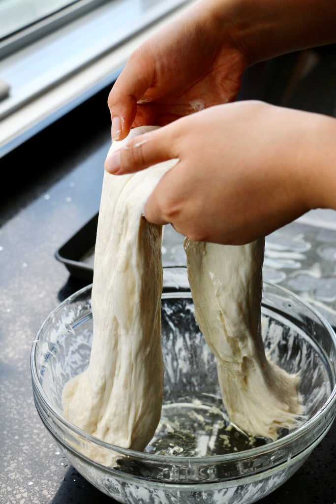 Hand kneading focaccia