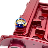 jdc titanium oil cap in a gradient burnt color on an evo 8 valve cover