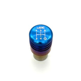 JDC Titanium piston-style shift knob with a beautiful burnt gradient color and jdc titanium and shift pattern logo laser-etched on the top