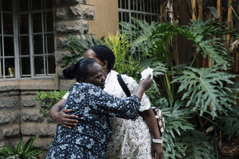 Maggie hugging a fellow employee at amani kenya