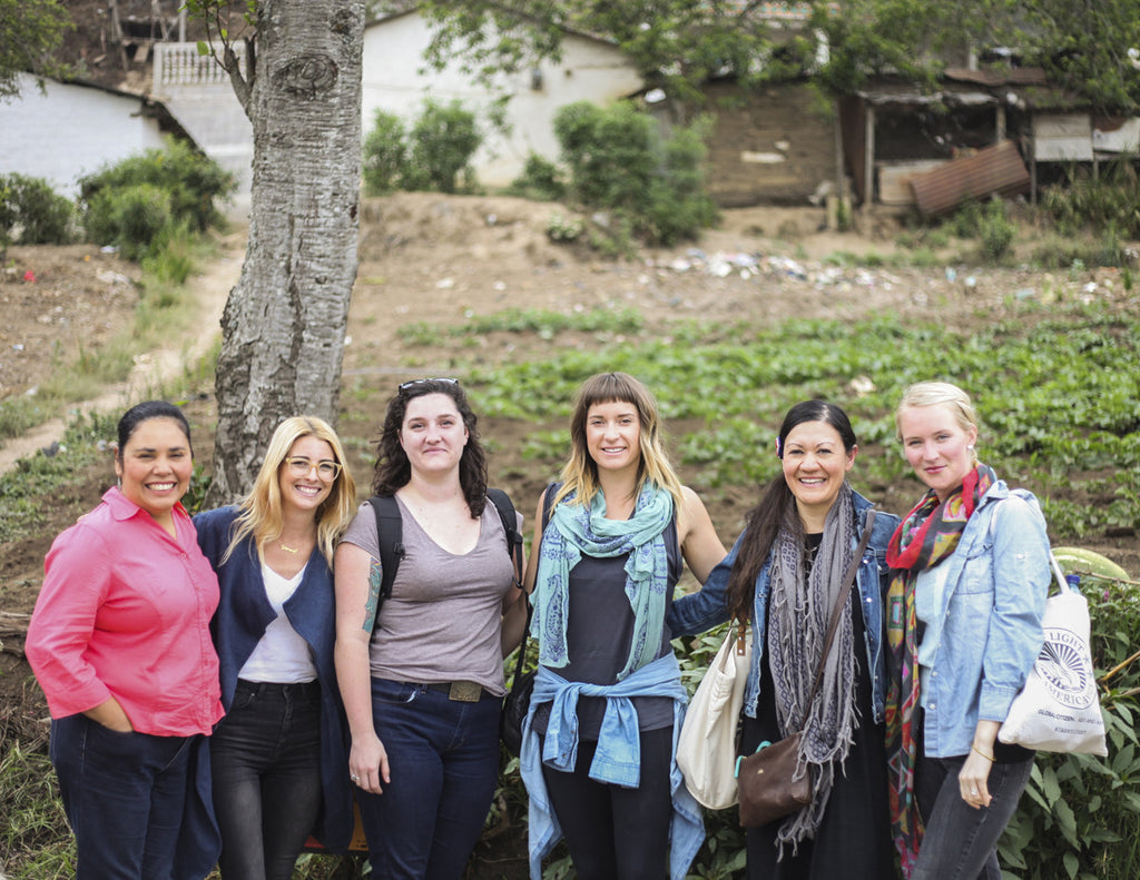 Tour participants pose with Hiptipico founder Alyssa in rural Guatemala, most transparent travel companies in Guatemala, how to experience Guatemala authentically, guatemala travel blogs, ethical travel bloggers