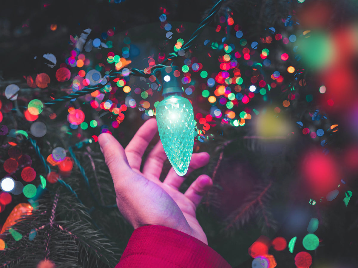 Man holding christmas bulb