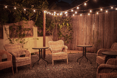Use Christmas lights to create a cozy outdoor space