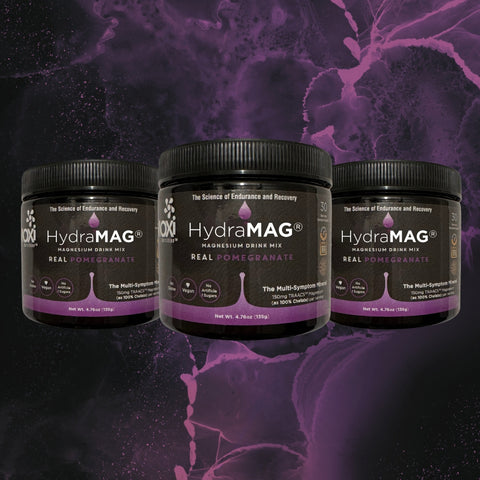 3 Tubs HydraMag High Absorbing Magnesium Drink Mix on Purple Splash Background