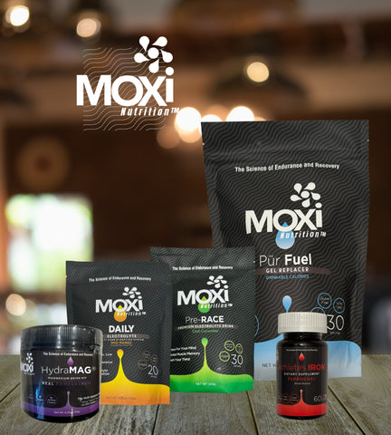 All Moxi Nutrition Product on Wooden Table with Moxi Logo