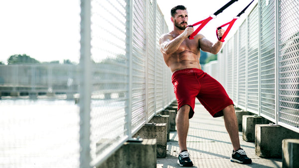 Guy in red shorts working out