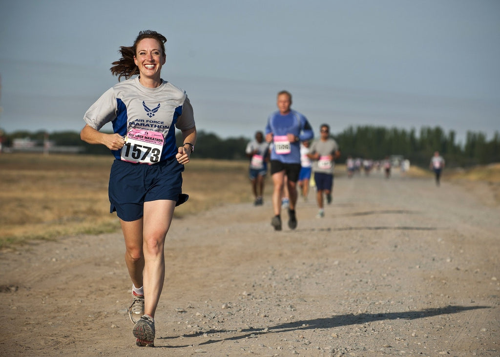 happy woman winning a marathon