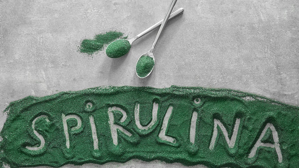 Spirulina spelled out in green spiraling powder