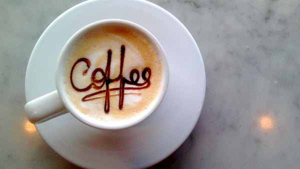 coffee spelled out in latte foam