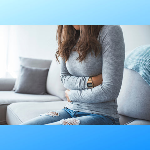 Teen girl holding her stomach because of period