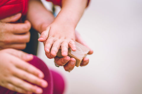 Redbudsuds with Adventure Mamas - child and mama with soap