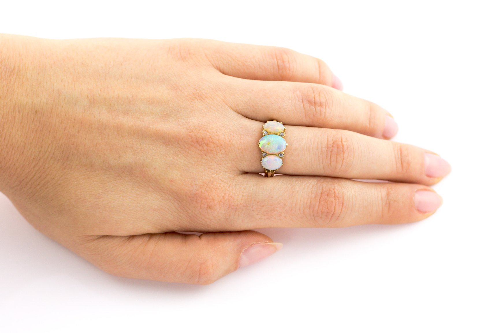 An antique opal trilogy ring
