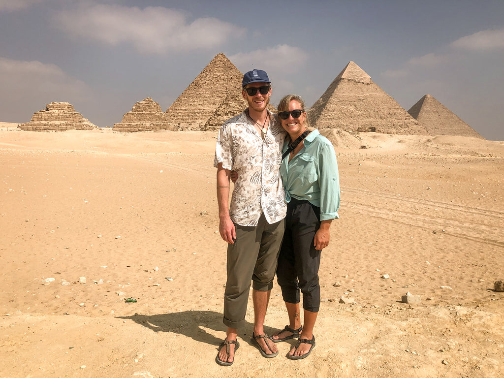 Two people in front of Egyptian Pyramids