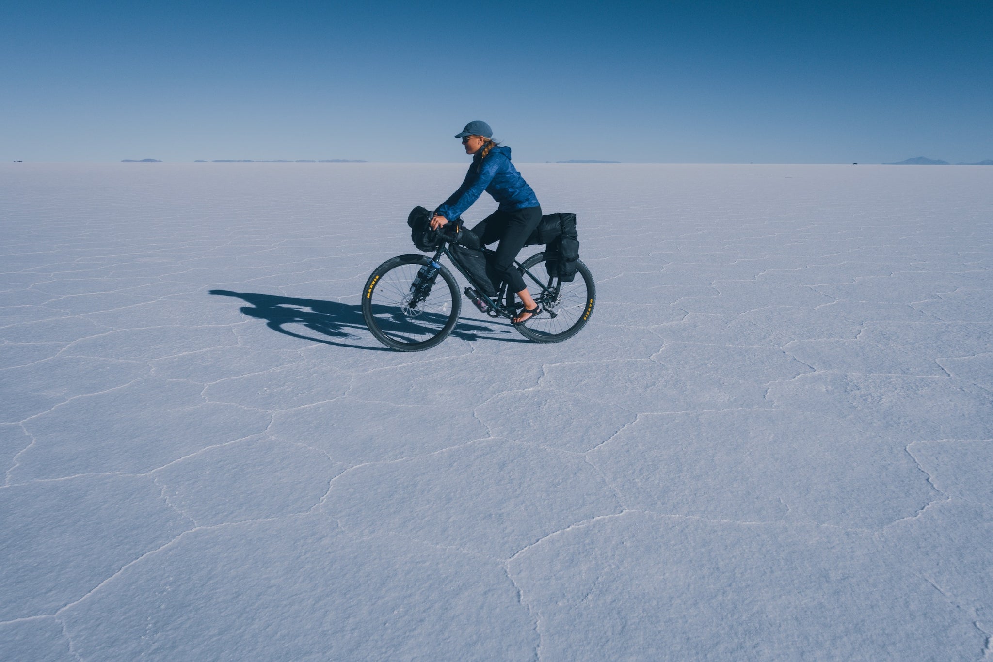 Bicyclist riding on salt flat