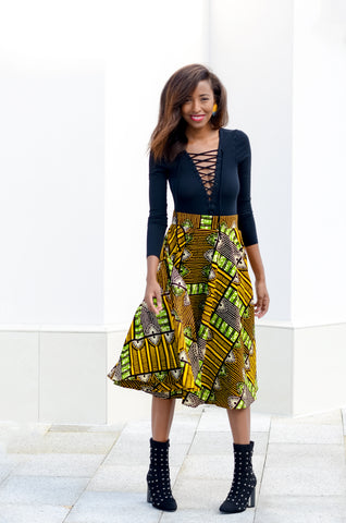 African print midi skirt in brown, black, yellow, and green with lace up bodysuit