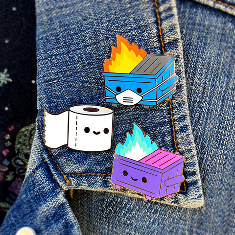  Enamel pins on a jean jacket; lil Dumpster Fire PPE edition, Lil TP, and the Magical Dumpster Fire pin