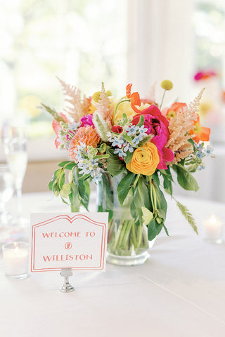 City sign table name with colorful flowers