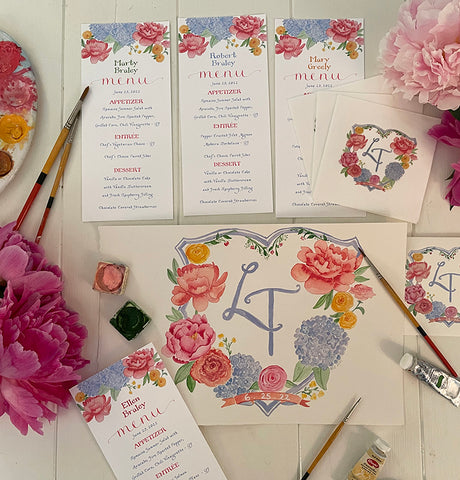 Watercolor floral custom crest on menus and napkins
