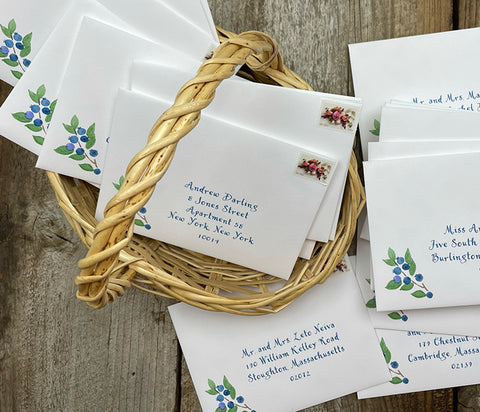 envelopes with digital calligraphy and blueberries