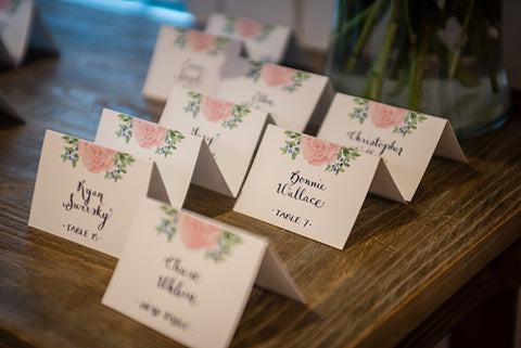 peony blueberry escort cards with hand calligraphy