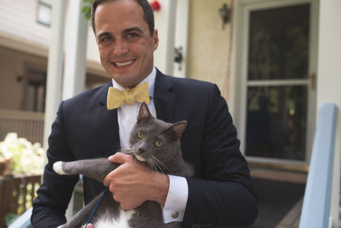groom with pet cat