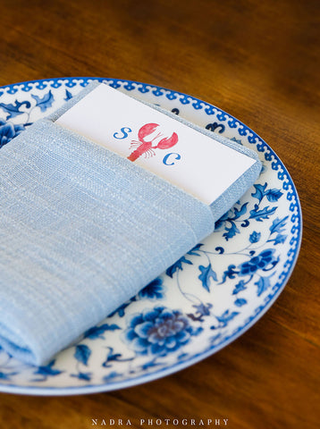 Lobster menu on blue pattern plate