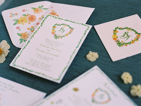 Custom crest and florals on wedding paper goods