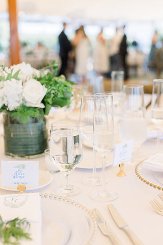 table with calligraphy escort cards