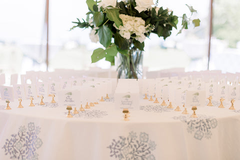 table with escort cards on stands