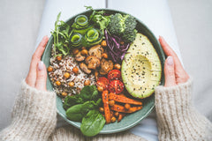 bowl of food on a person's lap