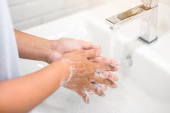 person washing hands for cold and flu prevention