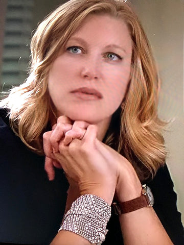 Skyler White wearing 2 stacked Flinging Arrows Liquid Metal Bracelets