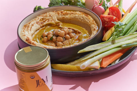 hummus with chickpeas and a side of celery, carrots and peppers