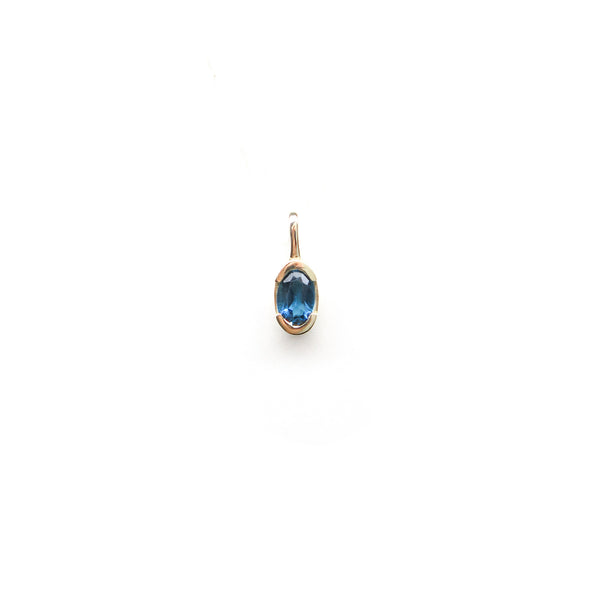Partial Bezel Set Oval Blue Topaz in Yellow Gold