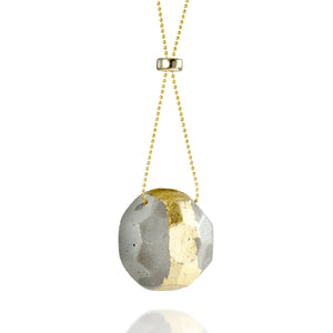 Round concrete pendant with golden imprint and its gold-filled chain