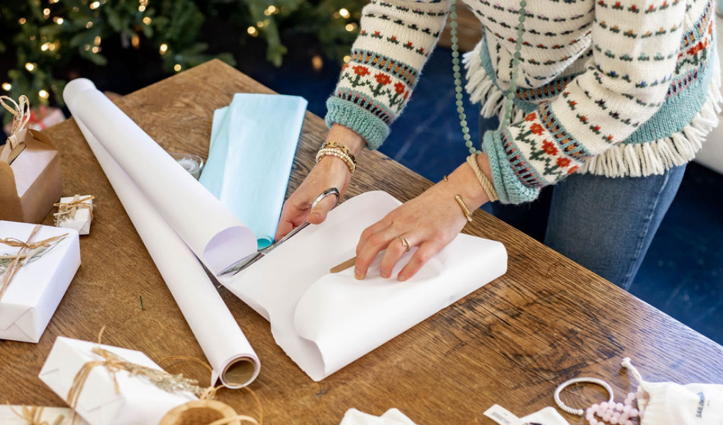 wrapping presents with beachy gift wrap for a coastal christmas 