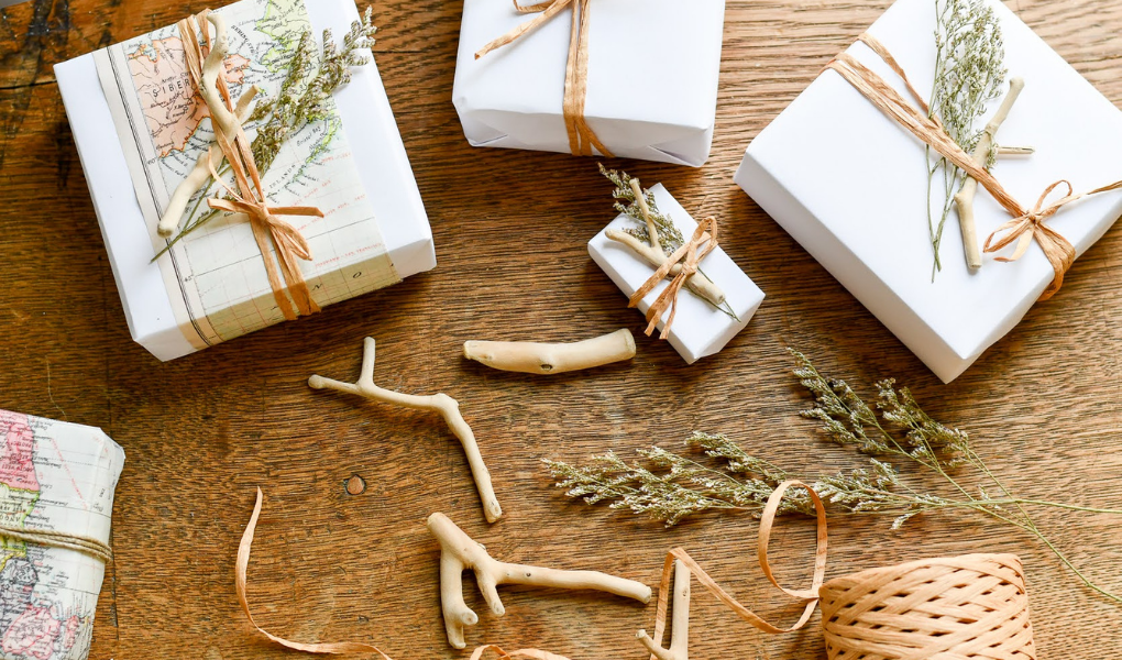 coastal christmas gift wrap with drift wood, dried flowers, and twine