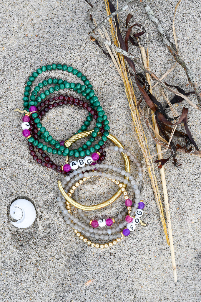 Rayminder UV Awareness bracelets for sun safety and uv protection in garnet, malachite, labradorite, gold with women's nautical stacking bracelets