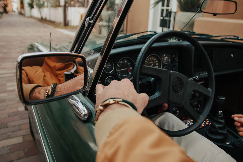 paul landry in vintage car wearing brooks brothers and sailormade nautical bracelets in Florida
