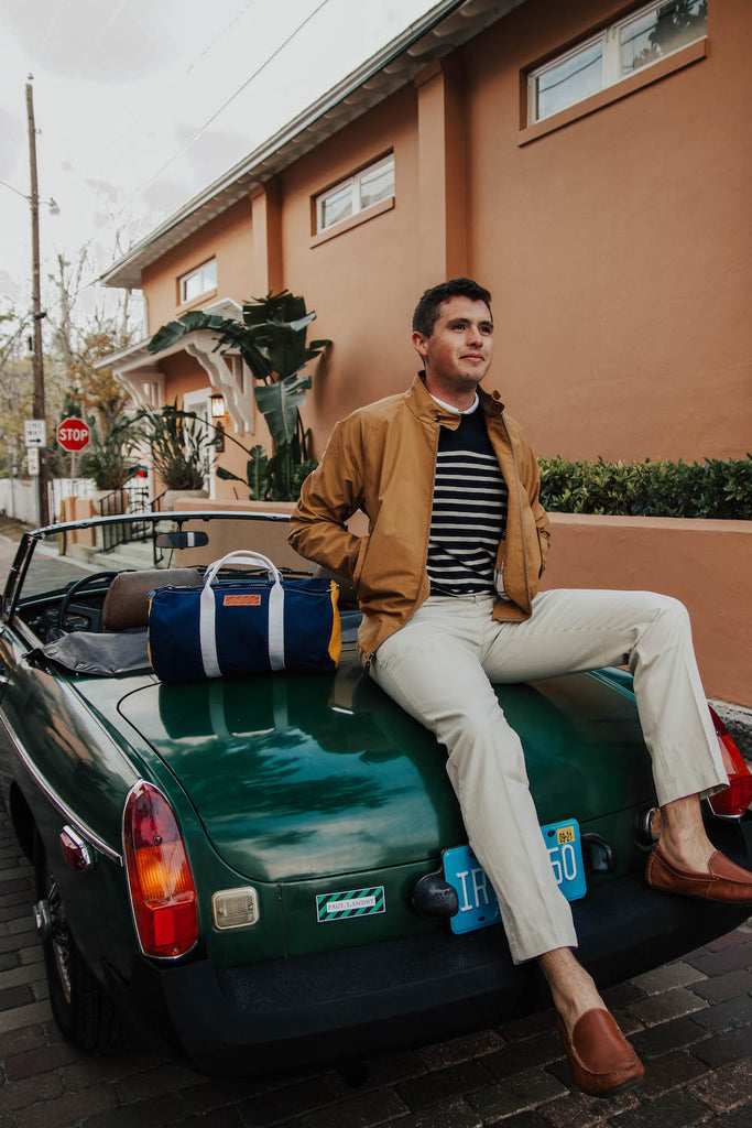 paul landry in vintage car wearing brooks brothers and sailormade nautical bracelets in Florida