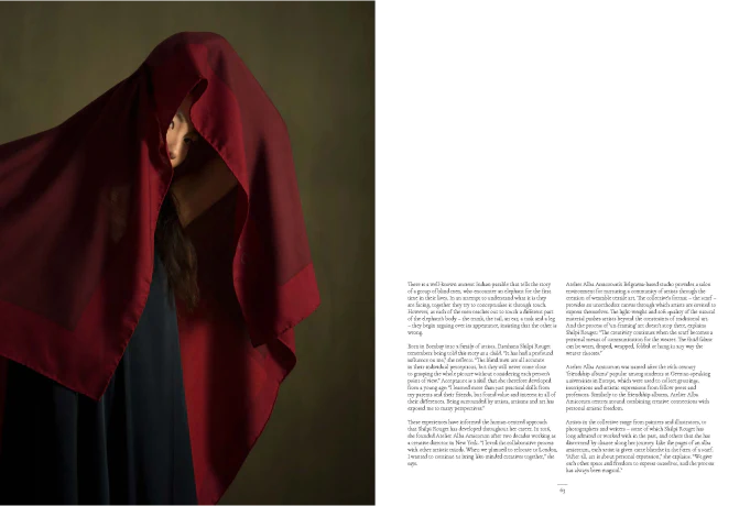 An image of a page of the Article below - A Fluid Canvas, a woman in a red color block albaamicorum scarf posing before an olive colored wall.. The text of the article is pictured as well - you can read the text below