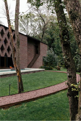 exterior view of Alex Gabriel's residence hightlighting intricate brickwork