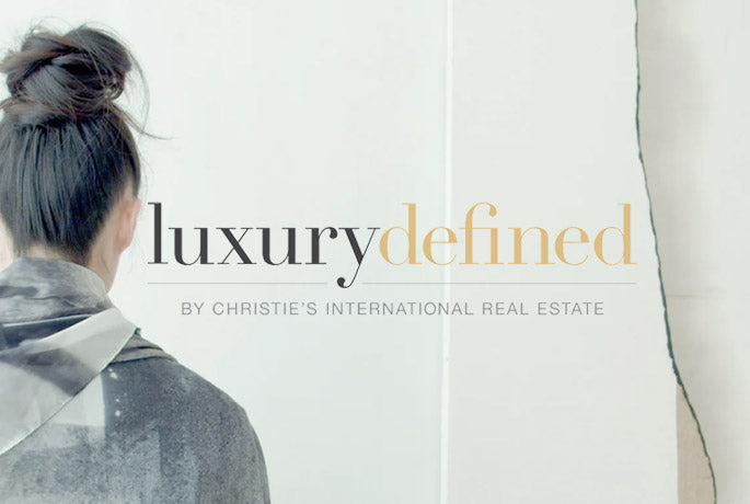 Christie's International Real Estate website logo - luxury defined and the back of a woman wearing and Alba Amicorum Man Ray scarf