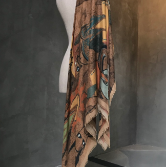 view of sacred stance scarf from side on dress form