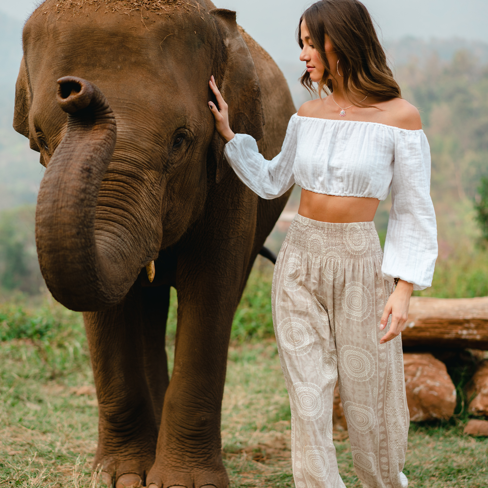 Woman Wearing Thai Harem Pants Photographed with Elephant