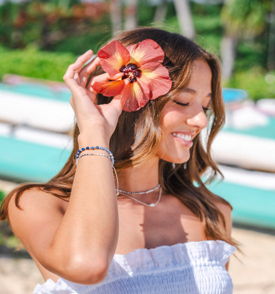 A woman with a flower in her hair