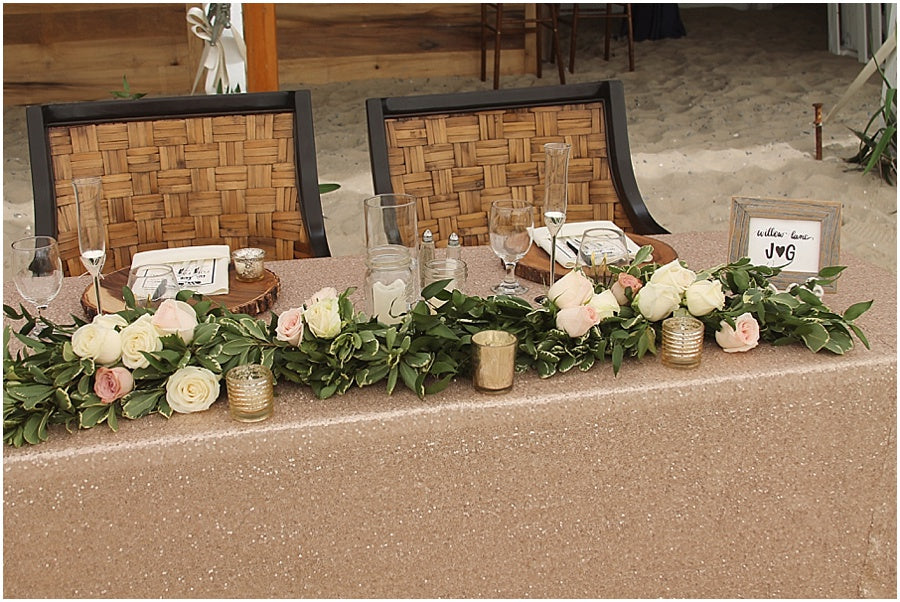 little miss lovely floral design // indian river life saving station wedding // rehoboth beach de wedding // sequin sweetheart table with garland